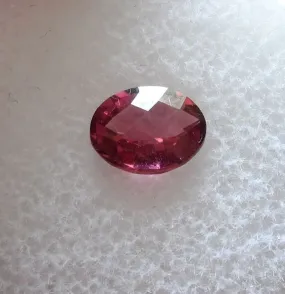 1.11 CTS. FANCY CHECKERBOARD OVAL CUT PINK/PURPLE MT. GARNET