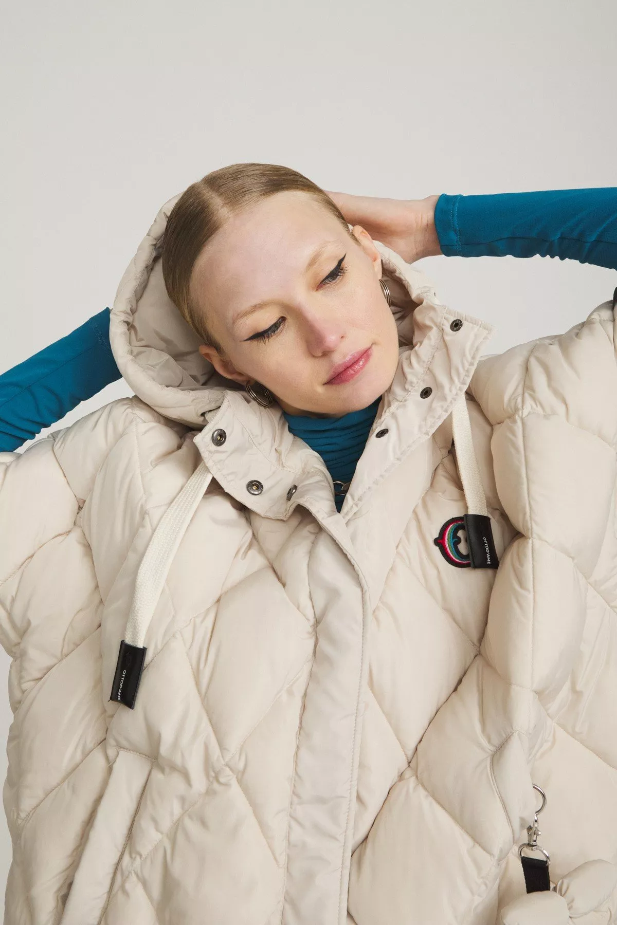 Cape-style puffer jacket
